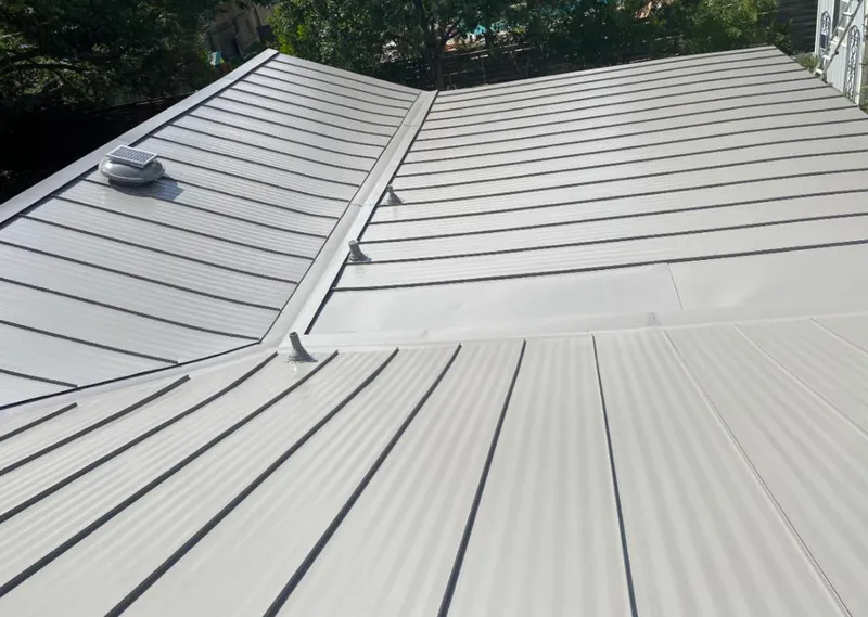 Solar attic fan installed on a metal roof for Roof Ventilation in Ballenger Creek